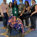 BDR conference attendees with a wheelchair.