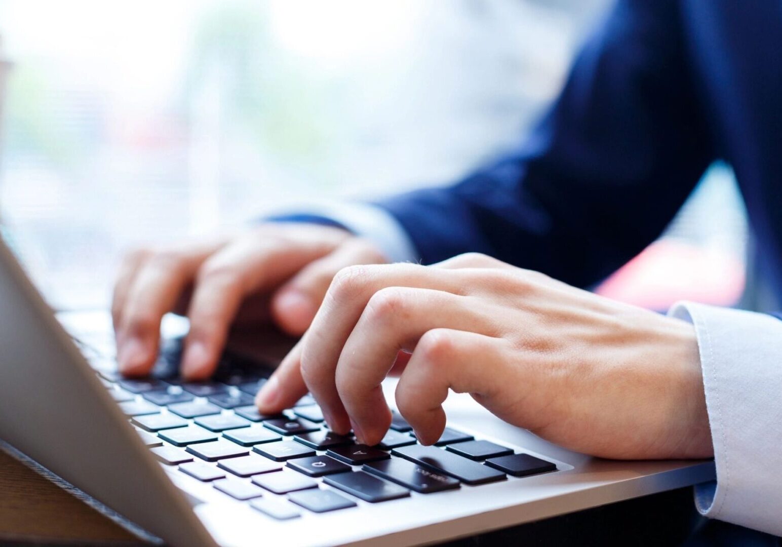 Hands on a computer keyboard